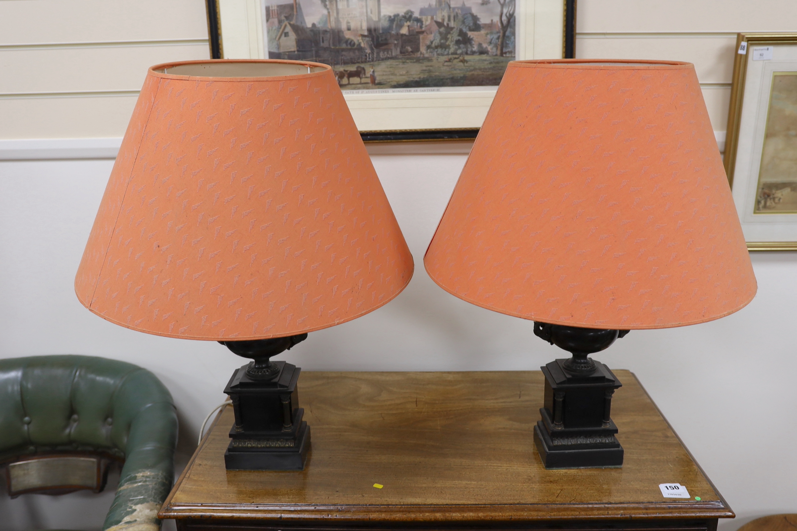 A pair of bronze and polished slate urns, converted to desk lamps (likely ex clock garniture), 34cm high excluding the fitting